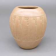 Buff jar with an oval opening and a sgraffito feather ring geometric design
 by Elston Yepa of Jemez
