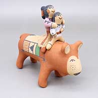 Polychrome pig figure with two riders
 by Clifford Kim Fragua of Jemez