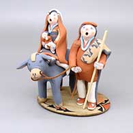 Titled Journey, a polychrome Flight to Egypt figure with a leather rein and a wood walking stick and cane
 by Mary Lucero of Jemez