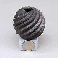 Miniature micaceous black spiral melon jar with a triangular geometric cut opening
 by Dominique Toya of Jemez