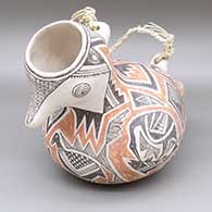 Polychrome bird jar with a braided rope handle and a Mimbres cloudeater, bird, and geometric design
 by Michael Kanteena of Laguna