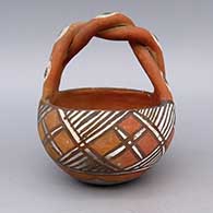Polychrome basket with braided handle and geometric design
 by Unknown of Isleta