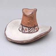 Polychrome cowboy hat figure with geometric design
 by Unknown of Isleta