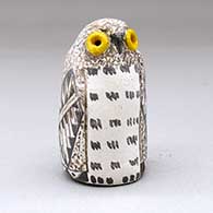 A small polychrome owl figure with a feather and geometric design
 by Kimo DeCora of Isleta