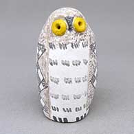 Small polychrome owl figure with yellow eyes and a checkerboard and fine line geometric design
 by Kimo DeCora of Isleta