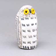 A polychrome owl figure with a bird element and geometric design
 by Kimo DeCora of Isleta