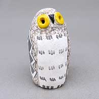 Small polychrome owl figure with yellow eyes and a fine line and geometric design
 by Kimo DeCora of Isleta