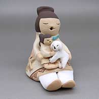 Polychrome storyteller with a child and a puppy
 by Stella Teller of Isleta