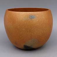 Micaceous gold bowl with fire clouds
 by Robert Vigil of Nambe