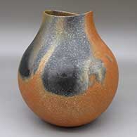 Micaceous gold jar with an organic opening and fire clouds
 by Lonnie Vigil of Nambe