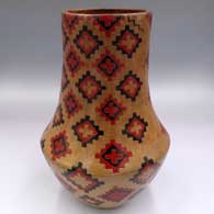 Polychrome tall neck jar with a sgraffito and painted Dineh carpet design
 by Lorraine Williams of Dineh