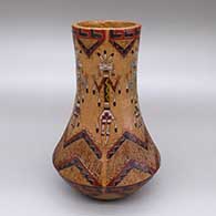Polychrome jar with a pine pitch coating and a sgraffito and painted male and female yei and Dineh carpet geometric design
 by Nancy Yazzie of Dineh