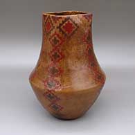 Polychrome jar with a square opening, a pine pitch coating, and a sgraffito and painted Dineh carpet geometric design
 by Lorraine Williams of Dineh