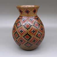 Polychrome jar with a flared opening, a pine pitch coating, and a sgraffito and painted Dineh carpet geometric design
 by Lorraine Williams of Dineh