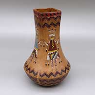 Polychrome jar with a square opening, a pine pitch coating, and a sgraffito and painted male and female yei and Dineh carpet geometric design
 by Nancy Yazzie of Dineh