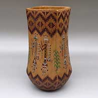 Polychrome jar with a square opening, a pine pitch coating, and a sgraffito and painted male and female yei, cornstalk, and Dineh carpet geometric design
 by Nancy Yazzie of Dineh