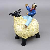 Polychrome sheep with rider figure with a pine pitch coating
 by Elizabeth Manygoats of Dineh