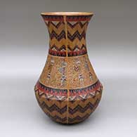 Polychrome jar with a flared opening, a pine pitch coating, and a sgraffito and painted male and female yei and Dineh carpet geometric design
 by Nancy Yazzie of Dineh