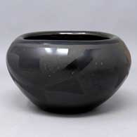 Black on black bowl with a 3-panel geometric design
 by Pablita Chavarria of Santa Clara