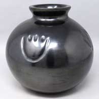 Black jar with a flared rim and 4-direction bear paw imprints
 by Virginia Ebelacker of Santa Clara