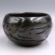 Black bowl carved with an avanyu design
 by Christina Naranjo of Santa Clara