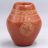 Small red jar with a sgraffito 4-medallion, feather and geometric design
 by Sunday Chavarria of Santa Clara