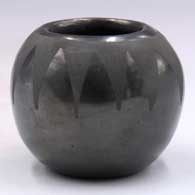 Small black-on-black bowl with a geometric design around the opening
 by Unknown of Santa Clara
