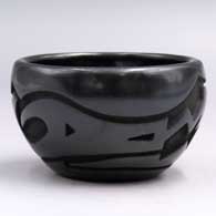Small black bowl carved with an avanyu and geometric design and polished inside
 by Sherry Tafoya of Santa Clara