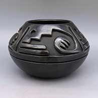 Black jar carved with a geometric design
 by Teresita Naranjo of Santa Clara