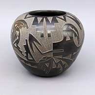 Black seed jar with sienna spot and sgraffito avanyu, butterfly, and geometric design
 by Candelaria Suazo of Santa Clara
