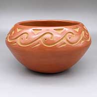 Red bowl with a carved geometric design
 by Chris Martinez of Santa Clara