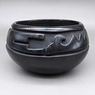 Black bowl with a carved geometric design
 by Stella Chavarria of Santa Clara
