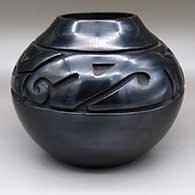 Black jar with a carved geometric design
 by Luann Tafoya of Santa Clara