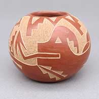 Small red jar with a sgraffito avanyu, butterfly, raincloud, kiva step, and geometric design
 by Candelaria Suazo of Santa Clara