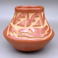 Red jar with a carved avanyu, kiva step, and geometric design
 by Chris Martinez of Santa Clara