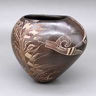 Sienna oval-shaped jar with an organic opening and a sgraffito avanyu and underwater plant design
 by Bernice Naranjo of Taos