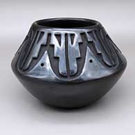 Black bowl with a carved kiva step and geometric design
 by Chris Martinez of Santa Clara
