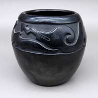 Black-on-black jar with a carved and painted avanyu design
 by Toni Roller of Santa Clara