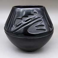 Black jar with a carved feather ring and geometric design
 by Mary Singer of Santa Clara