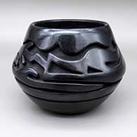 Black jar with a carved avanyu design
 by Teresita Naranjo of Santa Clara