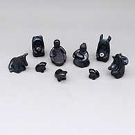 Thirteen-piece miniature black-on-black nativity set
 by Linda Askan of Santa Clara