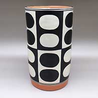 Large polychrome cylinder with a geometric design
 by Thomas Tenorio of Santo Domingo