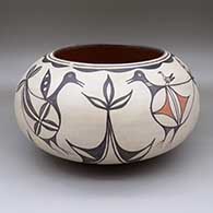 Large polychrome bowl with a bird, flower, and geometric design on the inside and a bird, chick, and geometric design around the outside
 by Ambrose Atencio of Santo Domingo