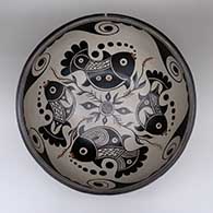 Large polychrome dough bowl with a fish, flower, and geometric design
 by Thomas Tenorio of Santo Domingo