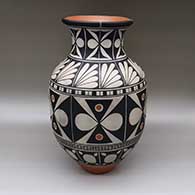 Large polychrome jar with a flared opening and decorated around the body with a butterfly and geometric design
 by Thomas Tenorio of Santo Domingo