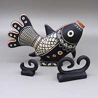 Three-piece polychrome fish figure set; includes a fish painted with a geometric design and two sculptural wave pieces
 by Thomas Tenorio of Santo Domingo