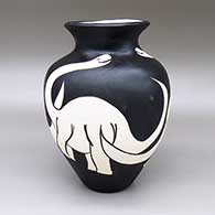Black-on-white jar with an organic form, a flared opening, and a brontosaurus dinosaur design
 by William Pacheco of Santo Domingo