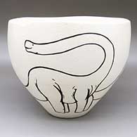 Large black-on-white bowl with an organic form and a brontosaurus dinosaur design
 by William Pacheco of Santo Domingo