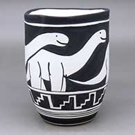 Click for a larger view A black on white jar with an organic rim and decorated with an allosaur and geometric design
by William Pacheco of Santo Domingo