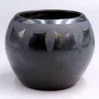 Black-on-black jar with a geometric design above the shoulder
 by Tonita Roybal of San Ildefonso